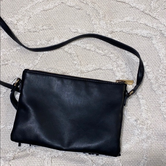 Black purse with tassels with gold detailing. - Picture 3 of 3